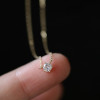 Fleur gold tone solitaire necklace detail