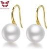 White freshwater pearl drop earrings detail