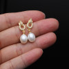 Gold tone freshwater pearl earrings detail