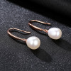 Rose gold tone pearl earrings detail