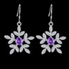 Silver tone purple zircon flower earrings on black background