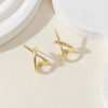 Silver tone stud earrings detail