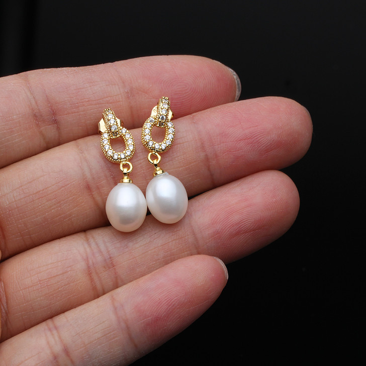 Gold tone freshwater pearl earrings detail