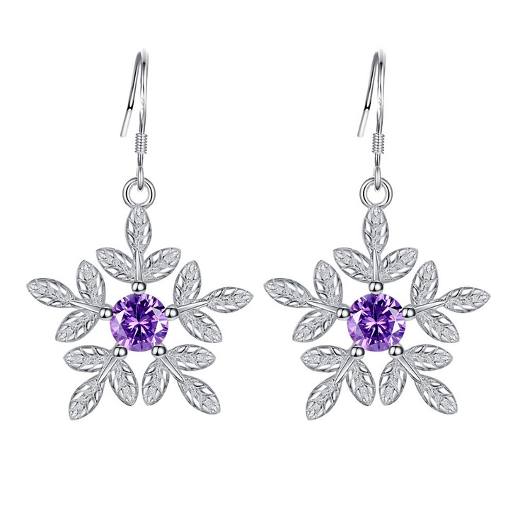 Silver tone purple zircon flower earrings on white background