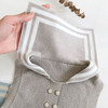 Engepapa Sand Dollar Beige Knitted Navy Collar Romper, beige knitted baby romper with navy collar and button details.