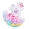 Generic First Easter Sets Tutu Skirt Short Sleeve Romper, a cute baby girl outfit featuring a white onesie with colorful embroidered Easter egg and bow design, paired with a layered pastel-colored tutu skirt with ruffles and a matching pink floral headband.