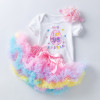 Generic First Easter Sets Tutu Skirt Short Sleeve Romper, adorable toddler Easter outfit with a white shirt featuring colorful embroidery and a pastel rainbow ruffled tutu skirt with a pink satin ribbon.