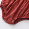 Generic Firebrick Ruffled Long Sleeve Romper Bodysuit, close-up of the bottom part showing ruffles and snap buttons.