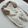 Generic Knitted Round Neck Bodysuit, image of two baby knitted bodysuits in beige and white color, placed on a white surface.