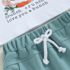 OONA 2PCS Easter Outfit Bunny Letter, close-up of the white T-shirt with bunny and carrot graphic and printed message, along with teal shorts with white drawstring.