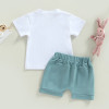 OONA 2PCS Easter Outfit Bunny Letter, white T-shirt and turquoise shorts for children, with a pink plush bunny toy beside.