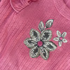 Generic Flower Layette Set 4 Piece, detailed embroidery of pink flowers with black and white accents on soft pink fabric.