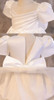 OONA White Bouffant Dress, elegant white dress with puffed sleeves and satin ribbon bow detail at the waist.