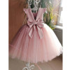 OONA Amelia Tulle Klosh, a pink toddler dress with a satin bow and ruffled shoulder straps featured in the image.