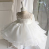 OONA Lea White Bouffant Dress, white formal dress for special occasions with pearl embellishments on the bodice and a layered, ruffled skirt.