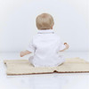 Minnie Me Noa 6-pcs Baptism Set With Shoes, baby doll sitting on a knitted blanket wearing a white baptism outfit with matching shoes.