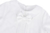 Minnie Me Nash Christening Romper, white christening baby romper with lace details and a large satin bow on the front.