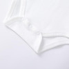 Minnie Me Cotton Romper Neutral, close-up of the white baby romper showing snap buttons at the bottom for easy dressing.