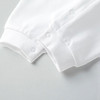Minnie Me White Romper Christening Essential, close-up of the white baby romper fabric with snap buttons on the cuffs and front, highlighting the elegant and simple design.