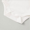 Minnie Me White Romper Cotton Essential, white baby romper with snap closures and soft cotton fabric.