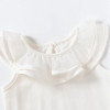 Minnie Me Hannah Baby Ruffled Bloomers Set, close-up of a white toddler's outfit with ruffled neckline.