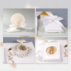 Minnie Me Baptism and First Communion Gift Set, elegant religious gift set including a shell with a white ribbon and pearl decoration, a white pillow with a bow, a rosary with an image of Our Lady of Guadalupe, and a prayer book with an image of Our Lady of Guadalupe, all designed for baptism and first communion occasions.