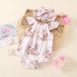 OONA Easter OutfitBunny Jumpsuit My First Easter, pink bunny-themed baby romper and headband with floral print, displayed on a decorative tray with flowers and perfume bottle.