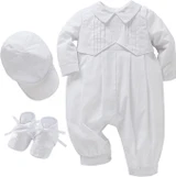 Minnie Me Bode Christening Romper Set, white baby christening outfit including a long-sleeve romper with embroidered cross detail, matching bonnet, and booties with lace and ribbon accents.