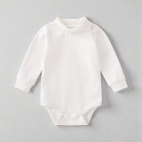 Minnie Me White Romper Cotton Essential, plain white baby romper with long sleeves, high neckline, and snap closures at the bottom.