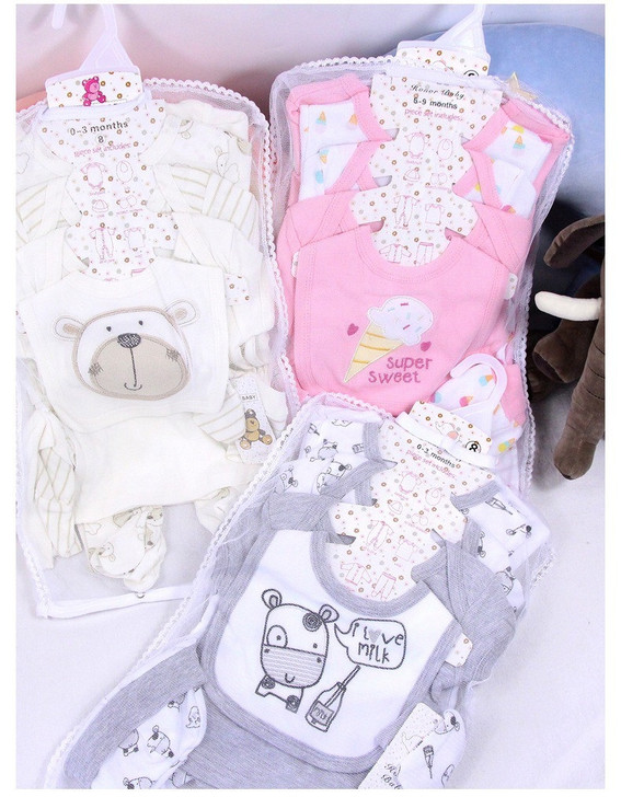 Generic White Sheep 8-Piece Layette Set, including various baby clothes with cute animal and ice cream prints, wrapped in clear plastic packaging.