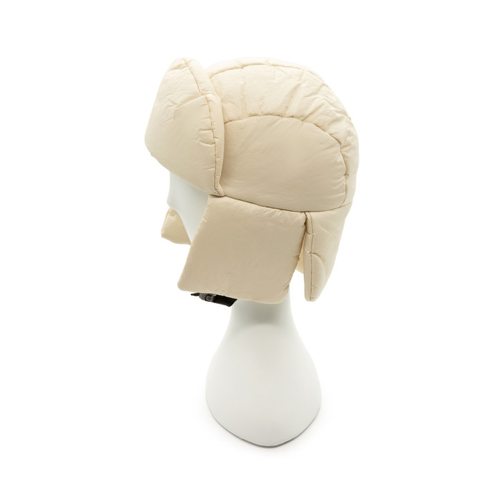 Generic Trapper Hat, cream-colored insulated trapper hat with earflaps designed for winter warmth and protection.