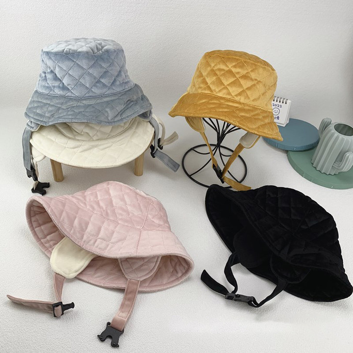 Generic Winter Bucket Hats Ear Flaps, display of four quilted winter bucket hats with ear flaps in gray, yellow, pink, and black on a white surface.