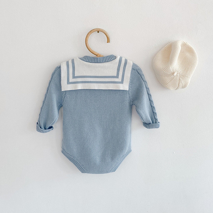 Engepapa Navy Collar Bow Knit Sweater Wrap Rompers, baby knit romper with nautical collar and bow detail on a wooden hanger, accompanied by a cream-colored knitted beret.