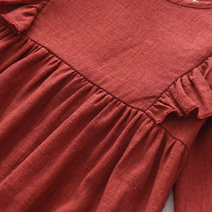 Generic Firebrick Ruffled Long Sleeve Romper Bodysuit, close-up of the reddish-brown ruffled fabric and textured long sleeves.