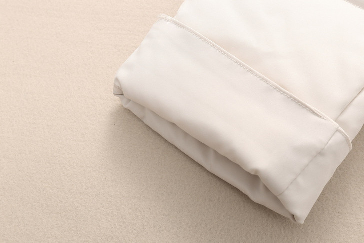 Generic Down Winter Ski Pants Waterproof Overalls, folded white waterproof ski pants with insulation for winter sports.