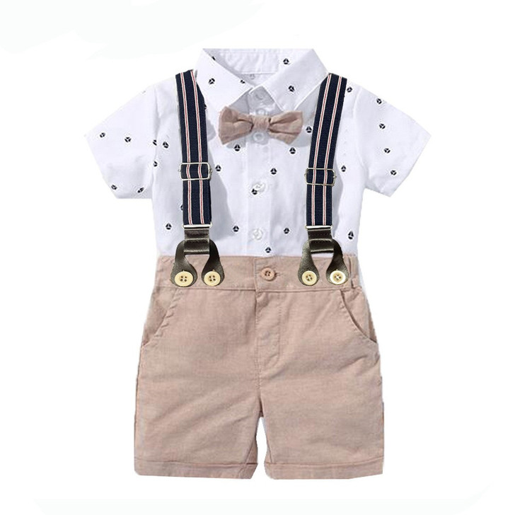 OONA Short-Sleeve Romper Short Suit with Hat, white shirt with small printed patterns, beige shorts with suspenders and a bow tie