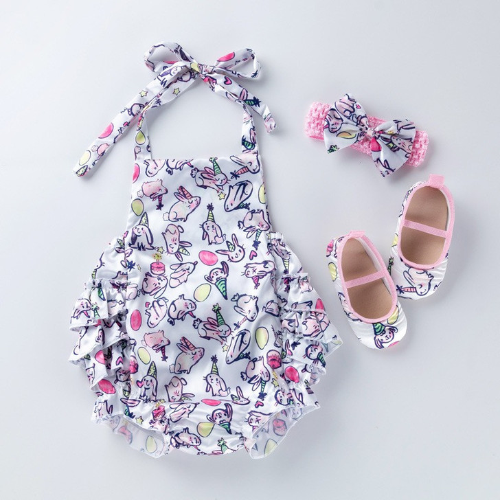 Generic Easter Egg Backless Romper Set, children's romper with unicorn and Easter egg print, toddler sleeveless outfit with ruffled edges, matching pink and unicorn printed shoes, and a bow headband.