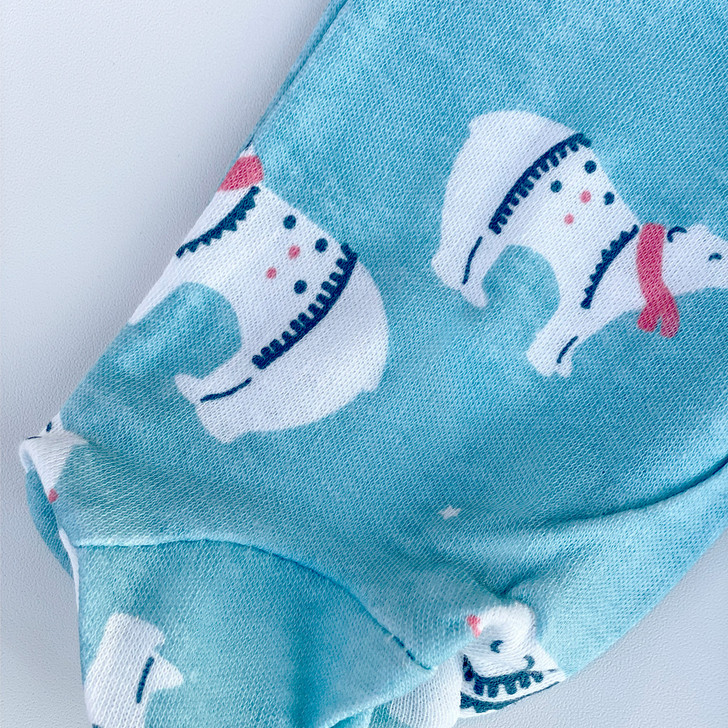 Generic Polar Bear Layette Set 5 Pieces, close-up of a light blue fabric with polar bear illustrations and decorative details.