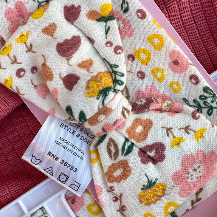 Generic Floral Layette Set 4 Pieces, baby clothing with colorful floral pattern on soft fabric.