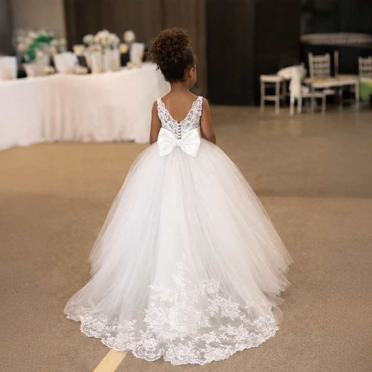 White sleeveless satin flower girl dress with princess-inspired styling