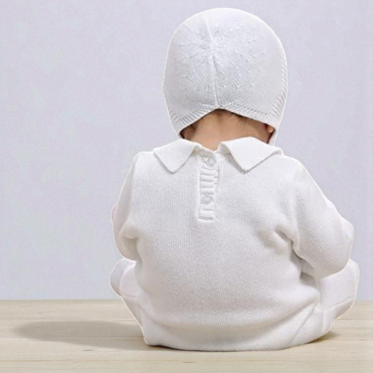 Minnie Me Noah Christening Romper, baby dressed in white christening romper and matching bonnet, back view.
