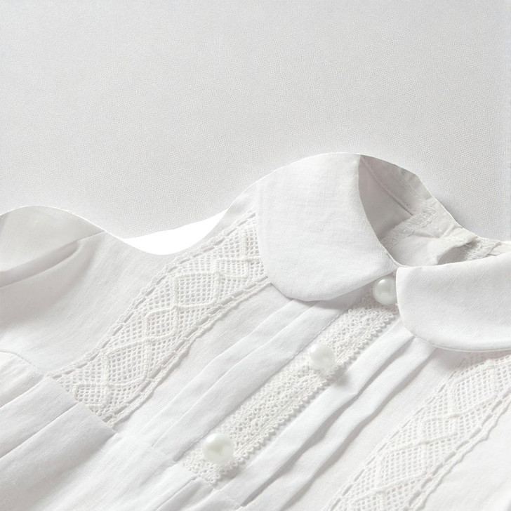 Minnie Me Mike White Baptism Romper, close-up of the white baptism romper featuring intricate lace details, pearl buttons, and a soft fabric texture.
