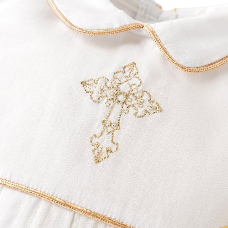 Minnie Me Elias Baptism Romper, close-up image of a white baptism romper with gold embroidered cross and gold trim detailing.