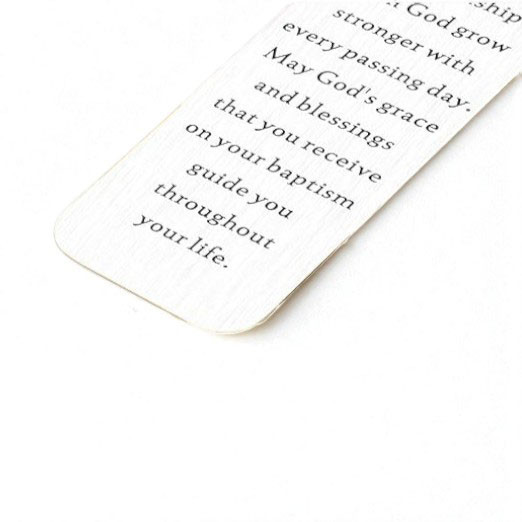 Minnie Me Silver Bookmark with Cross, close-up of the elegant silver bookmark featuring a delicate cross design.