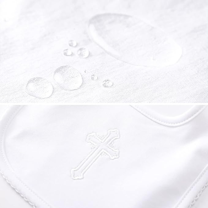 Minnie Me Cotton Romper Neutral, close-up of the white cotton romper showing water droplets and a subtle embroidered cross detail.