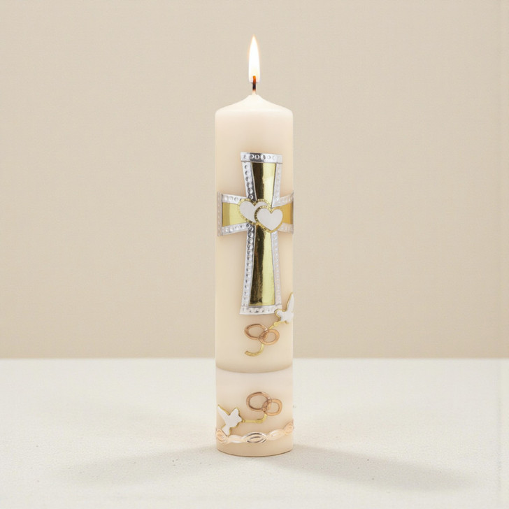 Minnie Me Authentic Unity Candles, a tall white candle with decorative gold, silver, and white accents including crosses, hearts, and doves, lit with a flickering flame.
