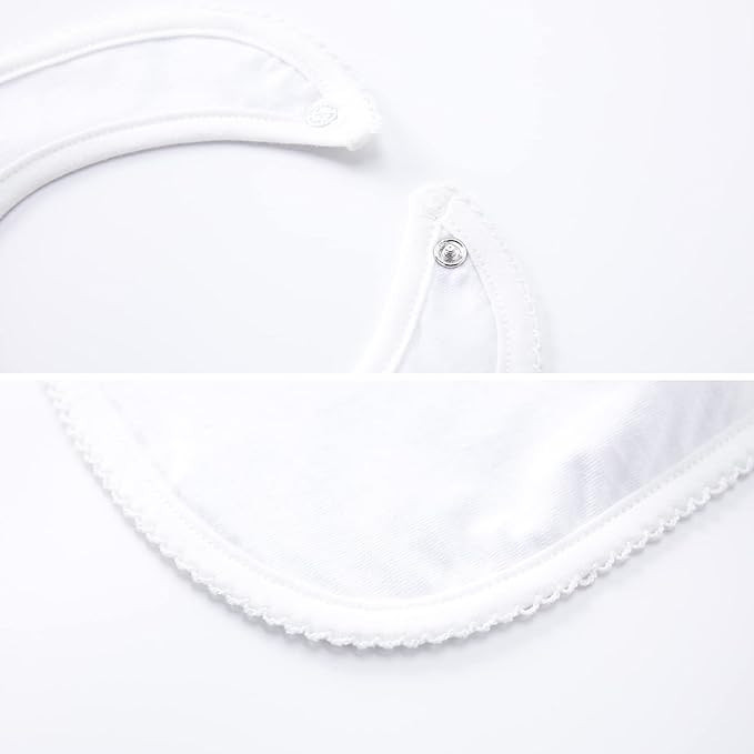 Minnie Me Cotton Romper Neutral Set, close-up image showing the soft white fabric and snap button closure details.