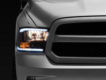 Raxiom R131482 - 09-18 Dodge RAM 1500/2500/3500 Axial Headlights w/ SEQL LED Bar- Blk Housing (Clear Lens)