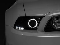 Raxiom 49170 - 13-14 Ford Mustang w/ Factory HIDLED Halo Projector Headlights- Black Housing (Smoked Lens)