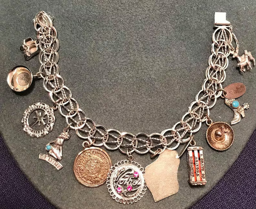 Baby shoes, bowl, cross, Gemini, Aztec calendar, MOTHER with one red stone and one pink stone, WIBC Bowling Tournament, A Crate of Arizona Sunshine, Sombrero, Arizona cowboy boot, and deer,Charm, silver, 1960's charms, sterling silver